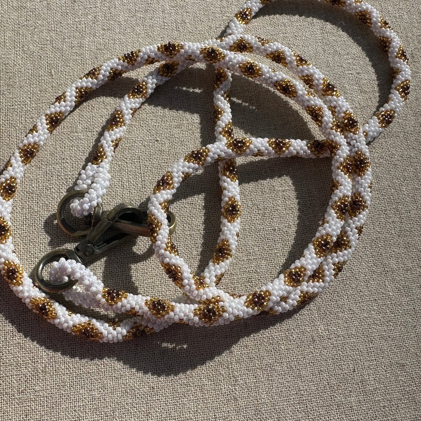 Cordon de Téléphone en Perles de verre – unique, tendance et  responsable  #A31 blanc, doré et bronze